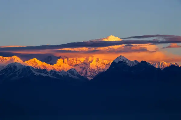 Stock image Kangchenjunga glows golden at sunrise, capturing the majestic beauty of the world's third highest peak. 