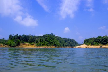  A serene and captivating view of the Sylhet region, showcasing the natural beauty of Bangladesh. This photograph features a pristine blue sky, perfectly reflecting the tranquil ambiance of the area. clipart