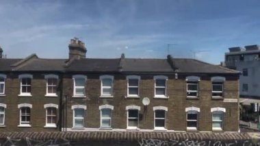 London city center view from moving train window, 4k England, United Kingdom - 22.06.2022 