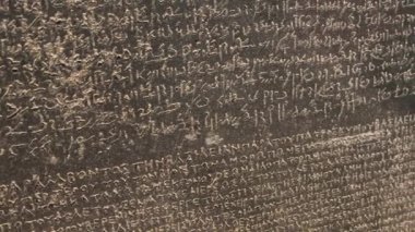 Close up of ancient text on big stone in historical museum