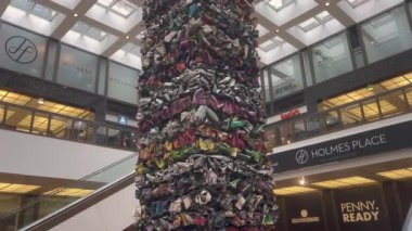 Big monument from used things in shopping mall