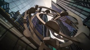 Low angle view on skyscrapers financial center office buildings reflecting clouds, timelapse hype lapse panoramic, London, England - 22.06.2022 