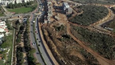 Aerial view of highway road with cars in city