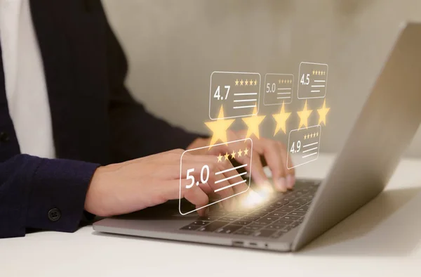 User give five star rating to service experience on computer app. Customers opinion evaluate the quality of services to reputation and business success. Customer review satisfaction survey concept.