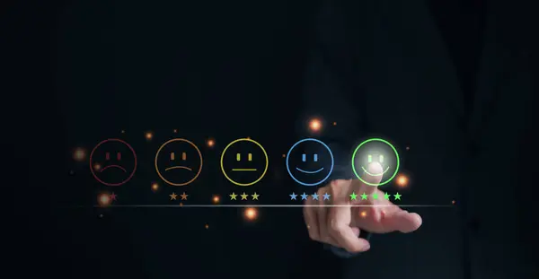 Customer review satisfaction feedback survey concept. Businessman pressing smiley face emoticon on virtual touch screen. quality review, best rating positive, poll or questionnaire for user experience