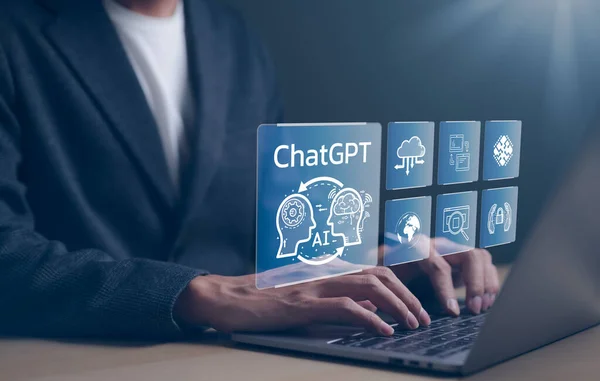 ChatGPT Chat with AI or Artificial Intelligence technology. businessman using a laptop computer chatting with an intelligent artificial intelligence. Developed by OpenAI. Futuristic technology.