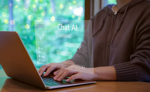 Chat with AI or Artificial Intelligence technology. Businessman using a laptop computer chatting with an intelligent artificial intelligence asks for the answers he wants. AI Prompt Generator,