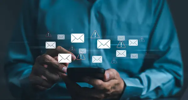 Email spam virus concept. Businessman reading electronic mail with smartphone. monitor internet security, Cybersecurity, and Cybercrime. Phishing email, Email fraud, Scam mail, virus alert, hacker,