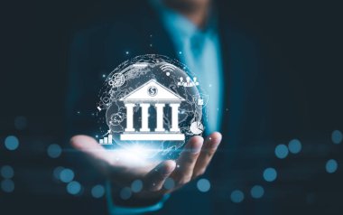 Dijital Bankacılık ve Finansal Teknoloji Konsepti. İş adamı, modern çevrimiçi ödeme sistemleri ve e-ticareti vurgulayarak dijital bankacılık ve finans teknolojisi ikonları ve para birimi sembolleri sundu.