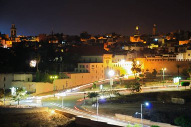 Light trails and historical architecure in Meknes city clipart