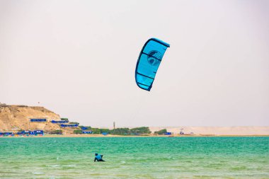 Dakhla, Morocco - 22 June 2022 : People Practicing Kitesurf on the Beach of Dakhla in the south of Morocco clipart