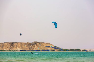 Dakhla, Morocco - 22 June 2022 : People Practicing Kitesurf on the Beach of Dakhla in the south of Morocco clipart