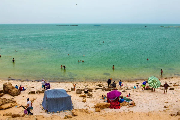 stock image Dkhala, Morocco - 20 June 2022 : People having fun in a tropical beach in Dakhla in Morocco