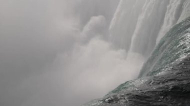 Powerful Waterfall in Nature's Raw Beauty Majestic Falls. Stunning footage of powerful, cascading waterfalls showcasing natures raw beauty. Ideal for nature, travel, and environmental projects needing an iconic, dramatic water scene.