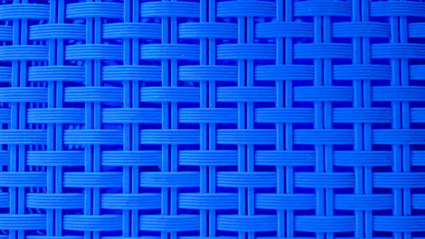 Mavi örülmüş plastik desenli yüksek çözünürlüklü yakın plan görüntü, arka planlar, endüstriyel tasarımlar, ambalaj dokuları veya soyut grafik elementler için ideal.