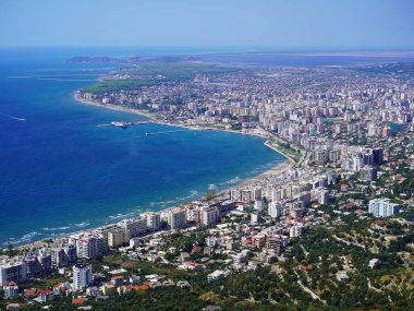 Aerial view of Vlor, a beautiful coastal city in Albania, featuring a stunning shoreline, modern architecture, and a vibrant urban clipart