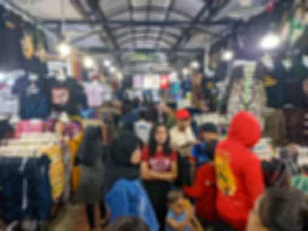 defocused abstract background of clothes market view