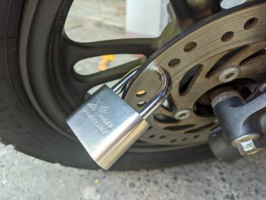 padlock that locks the motorcycle disk brake