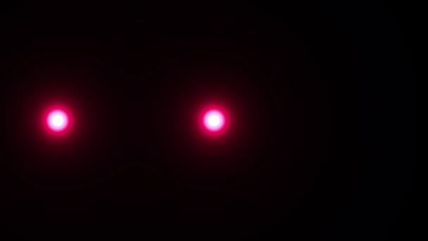 Zwei Rote Kugeln Leuchten Eine Statische Der Mitte Die Andere — Stockvideo