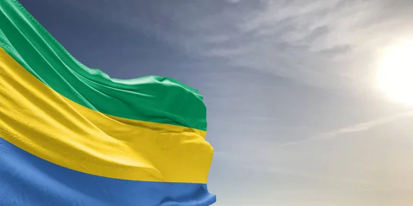Gabon Národní Vlajka Tkaniny Vlnění Krásné Šedé Obloze Pozadí — Stock fotografie