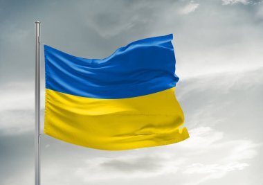 Güzel gri arka planda sallanan Ukrayna ulusal bayrak kumaşı.