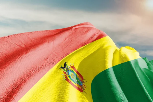 stock image Bolivia national flag cloth fabric waving on beautiful Sky Background.