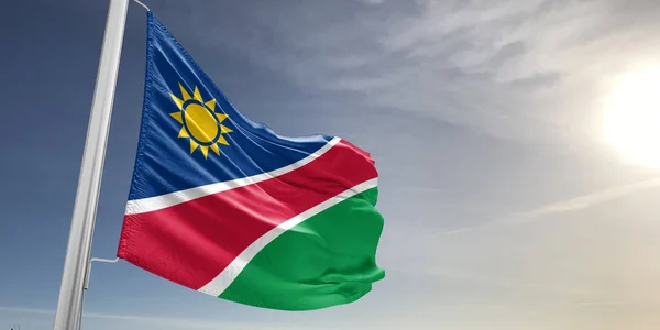 纳米比亚国旗布织物在美丽的灰色背景下飘扬 — 图库照片