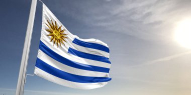 Gri arka planda sallanan Uruguay Ulusal Bayrak Kumaşı.