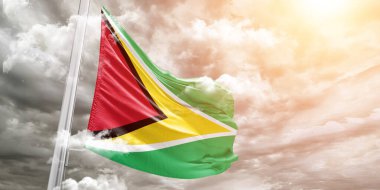 Guyana Ulusal Bayrak Kumaşı Güzel gri arka planda sallanıyor.