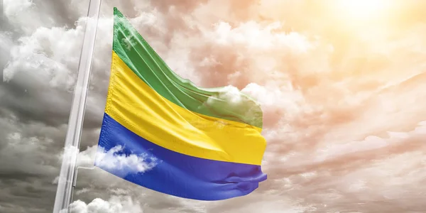 Gabon Tessuto Bandiera Nazionale Tessuto Sventolando Sul Bellissimo Sfondo Grigio — Foto Stock