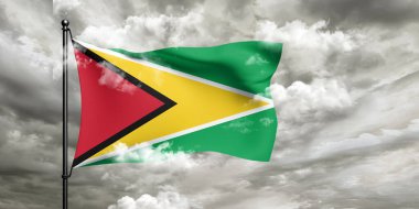 Guyana ulusal bayrak kumaşı güzel bulutlu arka planda dalgalanıyor.