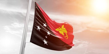 Papua Yeni Gine Ulusal Bayrak Kumaşı Güzel bulutlu arka planda dalgalanıyor.