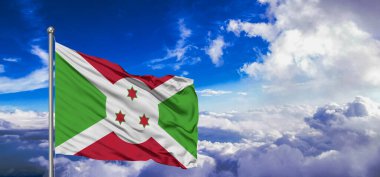 Burundi ulusal bayrak kumaşı güzel bulut arka planında dalgalanıyor..