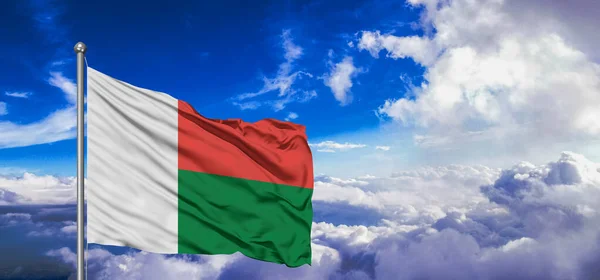 Madagascar National Flag Cloth Fabric Waving Beautiful Cloudy Background — Stock Photo, Image