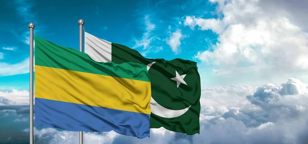 stock image Flags of Pakistan and Gabon friendship flag waving on the sky with beautiful sky.