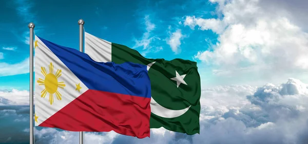 パキスタンとフィリピンの友情の旗が空に美しい空を振って — ストック写真