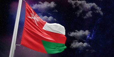 Umman Ulusal Bayrak Kumaşı Güzel bir arka planda sallanıyor.