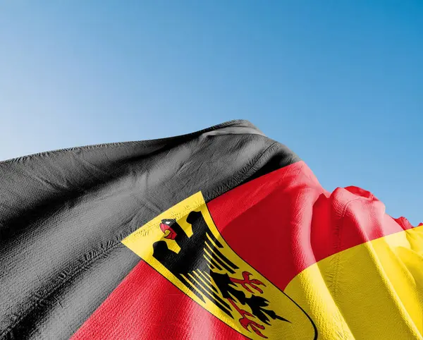 stock image Germany  national flag cloth fabric waving on beautiful sky blue Background.