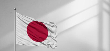 Japonya ulusal bayrak kumaşı güzel pencere açık gri arka planda sallanıyor.