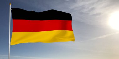 Almanya ulusal bayrak kumaşı güzel güneş ışığı gri arka planda dalgalanıyor.