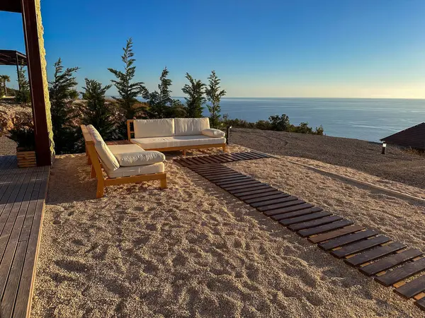 Relaxation area with panoramic sea view. Summer aesthetic.