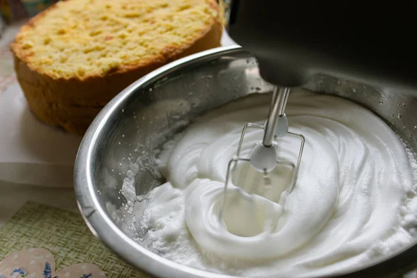 stock image dough preparation.Cake preparation process.Whipping cream.Whipping egg whites. Home baking.Mixer.baking recipe.Kitchen appliances.Cooking at home.Hobby.Cooking.Home cooking.Kitchen device.mixing.mix.Ingredients.