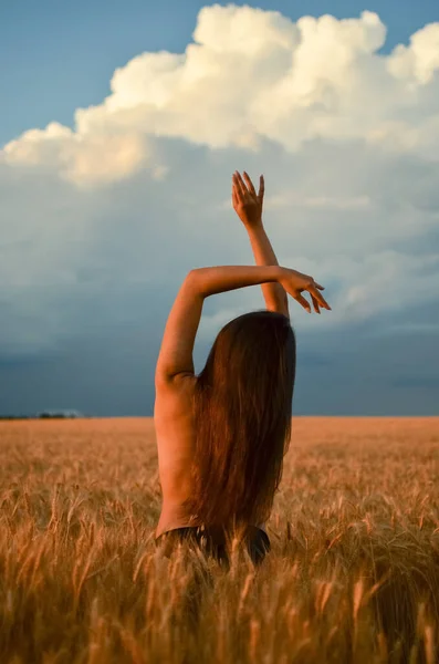 beautiful girl at wheat field.Girl with a naked back in the field.Blue sky and yellow field.Beautiful girl with long hair.Delicate photo of a girl.Nice photo in the field.Ukrainian field.Wheat.Girl without clothes.aesthetic beauty.female body.Wheat.