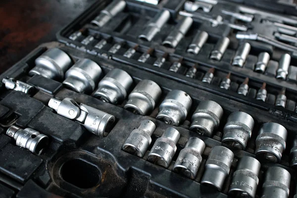 stock image old rusty metal wrench with nuts in the box.A set of tools.Tools in a suitcase.Car repair.Technology repair.Sial tools.Different diameter.