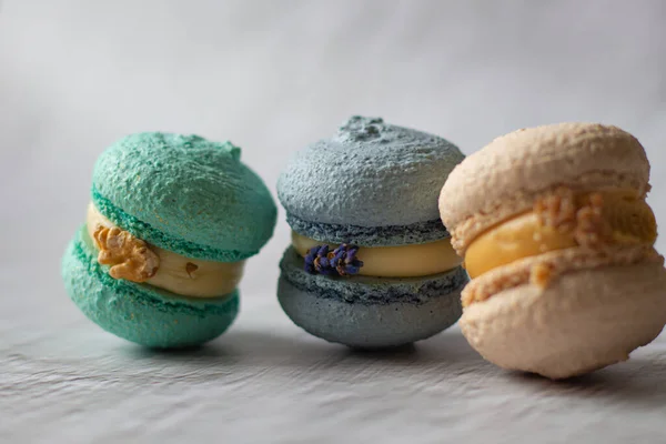 delicious macaroons with different flavors.french dessert.baking.french sweets.macaroons.bakery.food delivery.macaroons decor.different flavors.homemade cakes.cafe advertisement.beautiful dessert.delicate cream.cooking.holiday gift.cake.Nice.