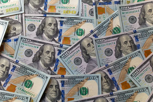 stock image Elevated view of 100 dollar bills.Financial background.international currency.dollars.currency exchange.wealth.salary.country economy.desktop wallpaper.money on the table.a lot of banknotes.bank credit.banking system.President Franklin.new banknote.