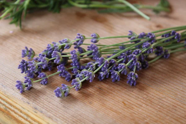 stock image Lavender bouquet on a wooden table