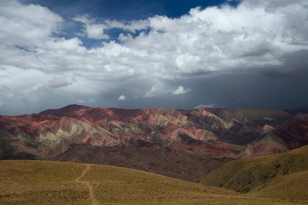 stock image Panorama view of the colorful rock formations and arid environment. Beautiful landscape of the mountains and cloudy sky 