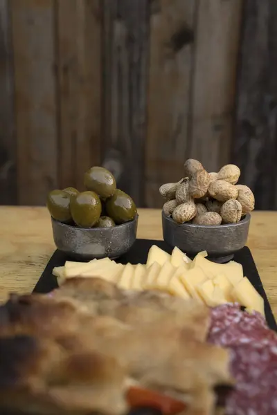 Antipasto Selective Focus Green Olives Peanuts Cold Cuts Dish Cheese — Stock Photo, Image