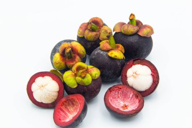 Mangosteen fruits with cut isolated on white background clipart